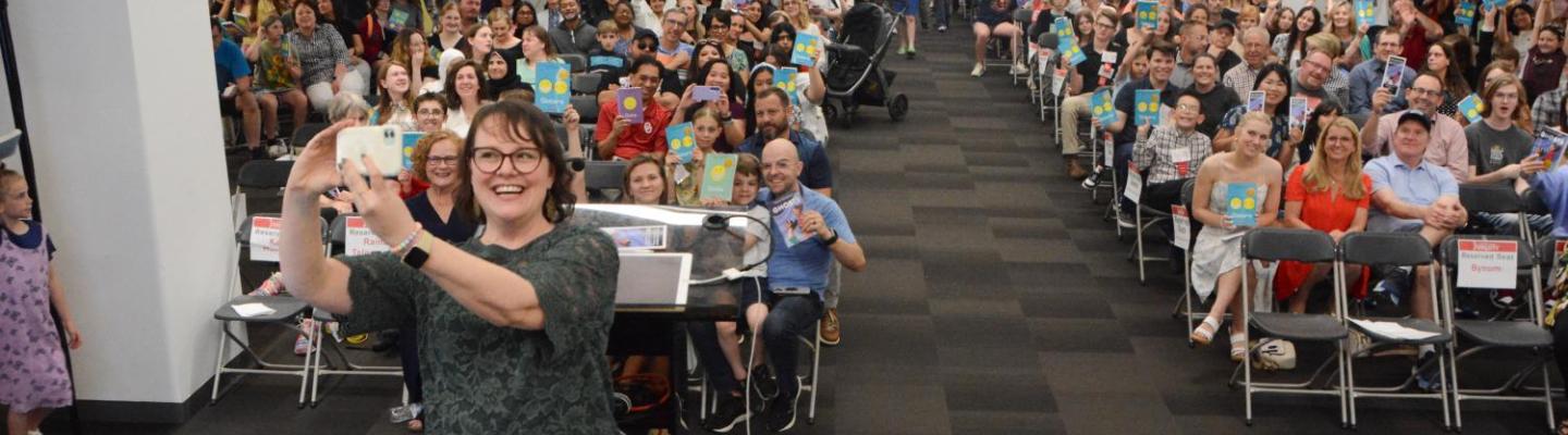 2024 Zarrow Award Winner Raina Telgemeier with winners of the Young People's Creative Writing Contest and audience