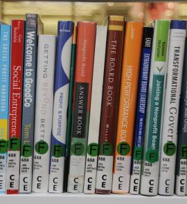 row of book spines about nonprofit board leadership